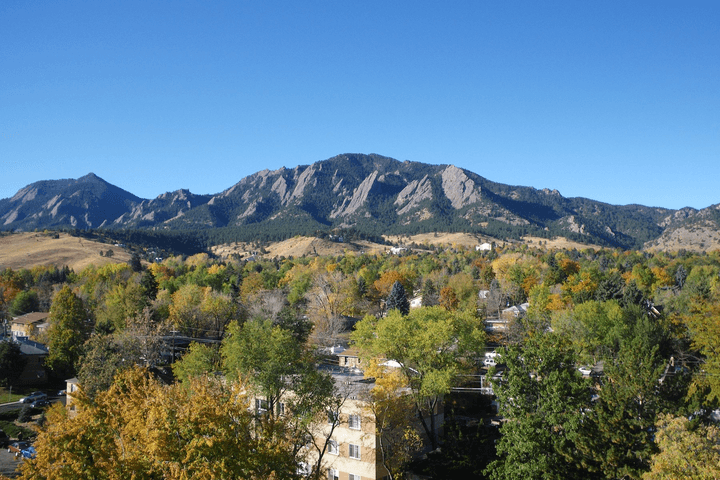 The Flatirons above Boulder's neighborhoods in autumn
