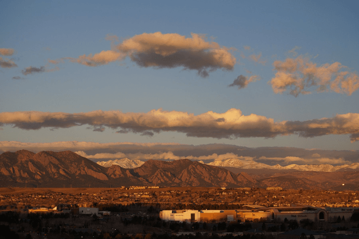 The Flatirons and the Front Range at sunset, seen across Broomfield